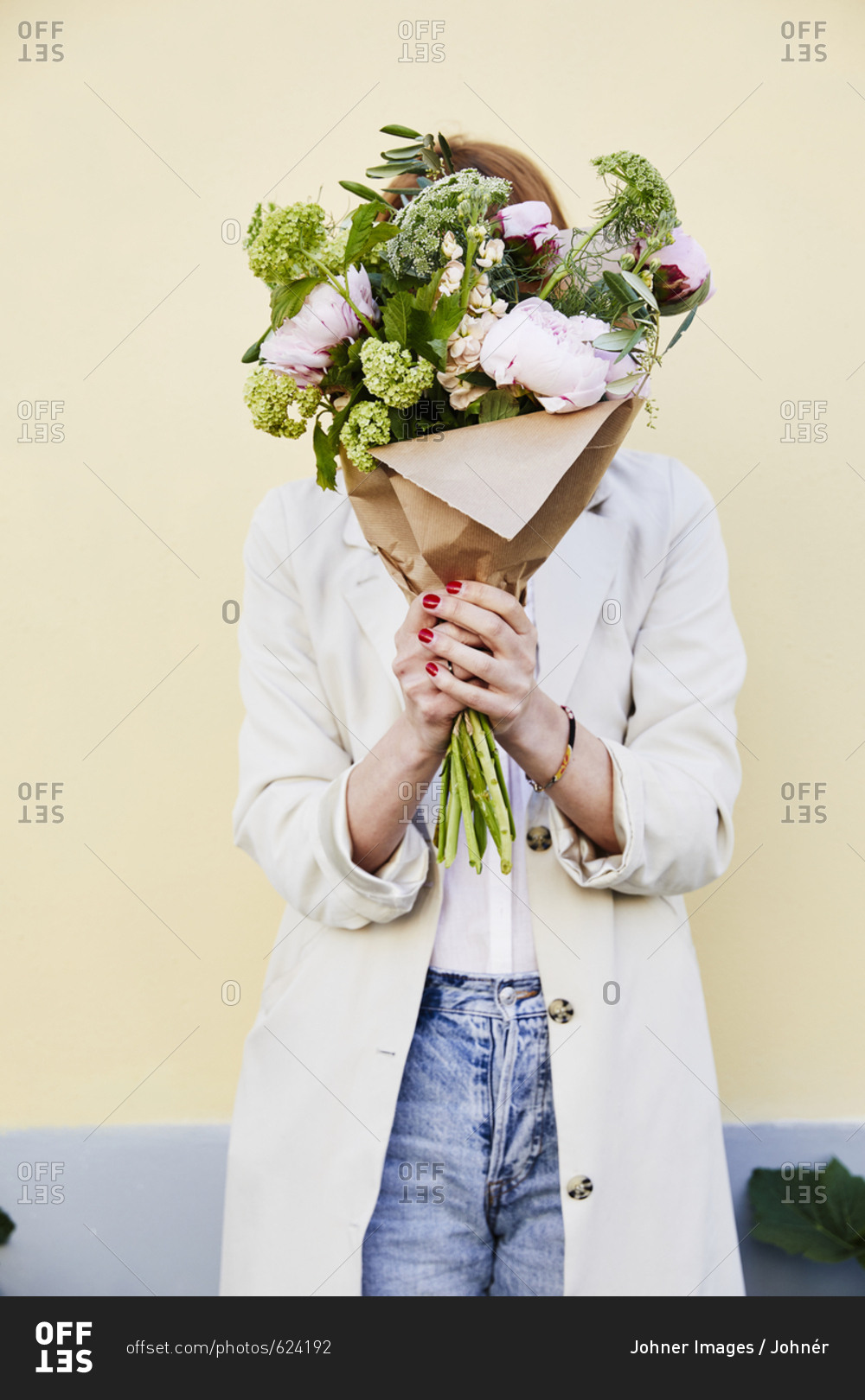 Woman holding bouquet of flowers