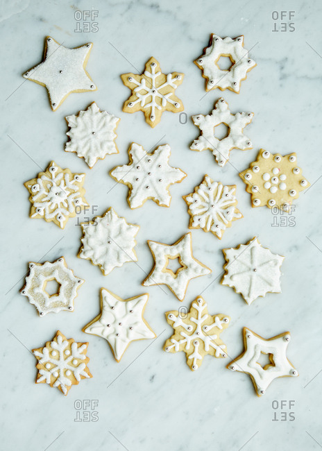 Fancy Winter Sugar Cookies Decorated With Royal Icing And Sprinkles On A White Marble Surface Stock Photo Offset