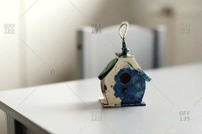 Small bird house painted by a child