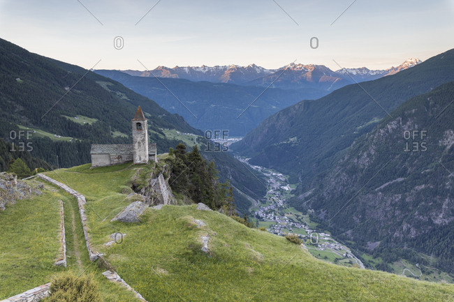 Ancient church at sunrise, San Romerio Alp, Brusio, Canton of Graubunden, Poschiavo Valley, Switzerland, Europe