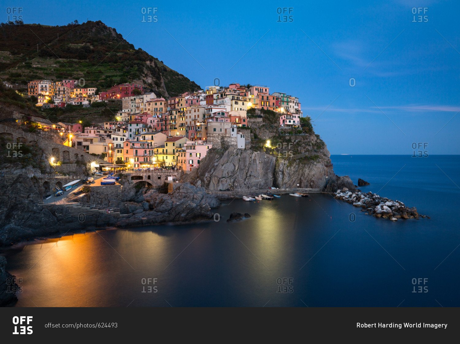 A long exposure at blue hour as the lights come on in the colorful town of Manarola, Cinque Terre, UNESCO World Heritage Site, Liguria, Italy, Europe