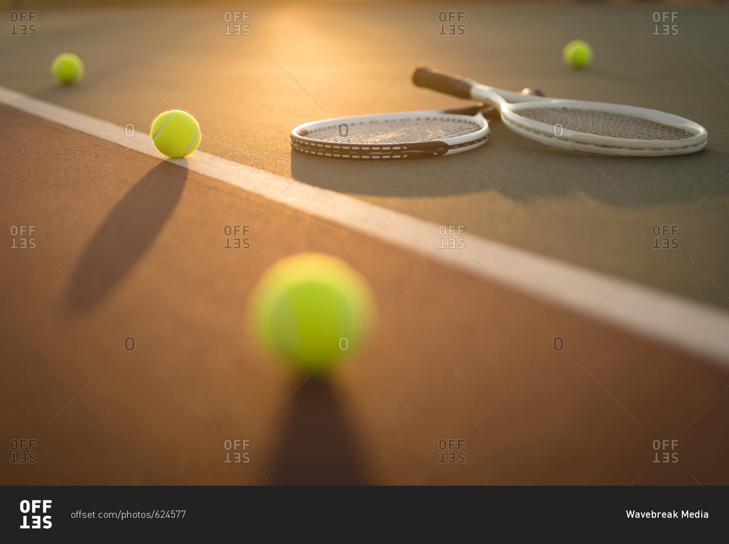 Tennis Balls And Rackets In Ground On A Sunny Day Stock Photo - Offset