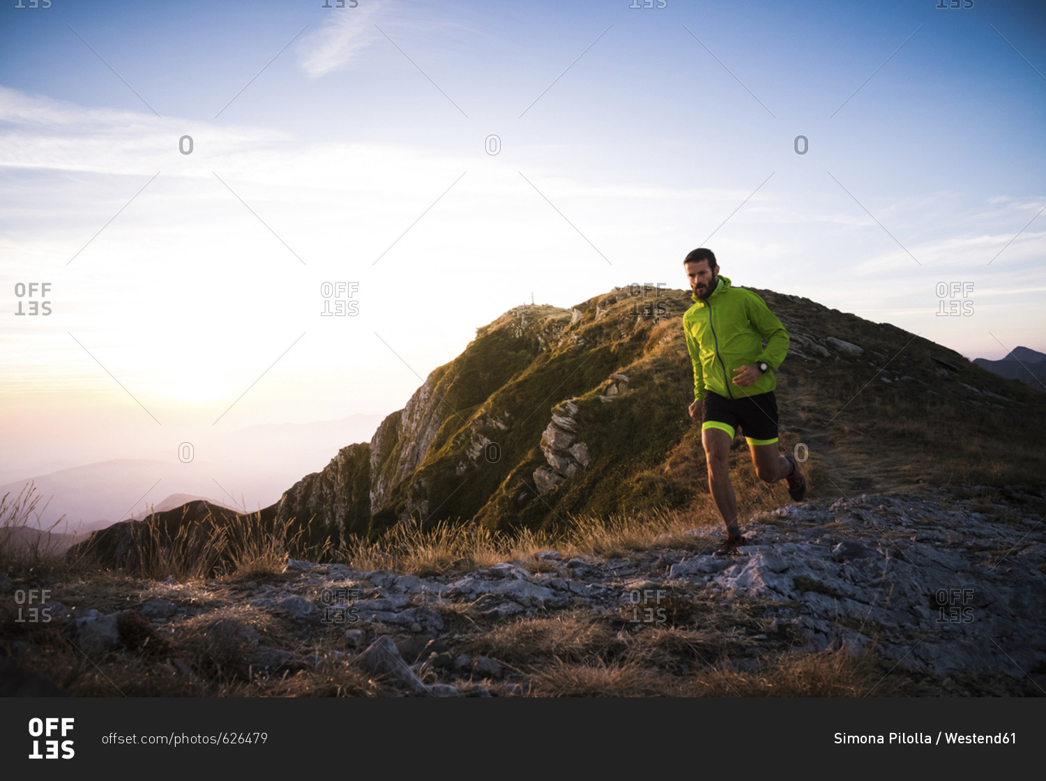 Italy- man running on mountain trail