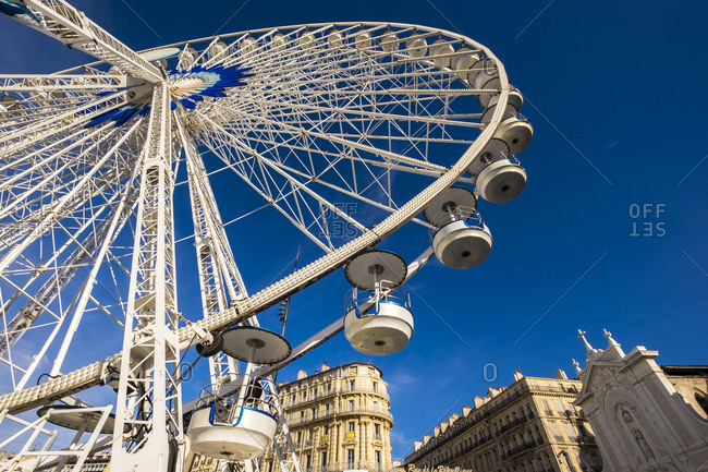 Marseille, France - March 6, 2017: Ferris wheel at Old port, Vieux Port, Marseille, Bouches-du-Rhone, Provence-Alpes-Cote d'Azur, Southern France