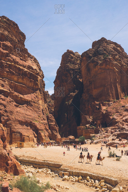 Petra, Jordan - April 7, 2017: Tourists at the ruins and canyons in Petra, Jordan