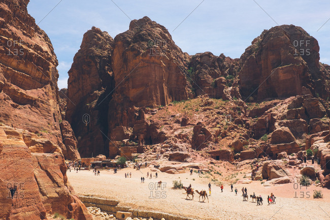 Petra, Jordan - April 7, 2017: Tourists at the canyons and ruins in Petra, Jordan
