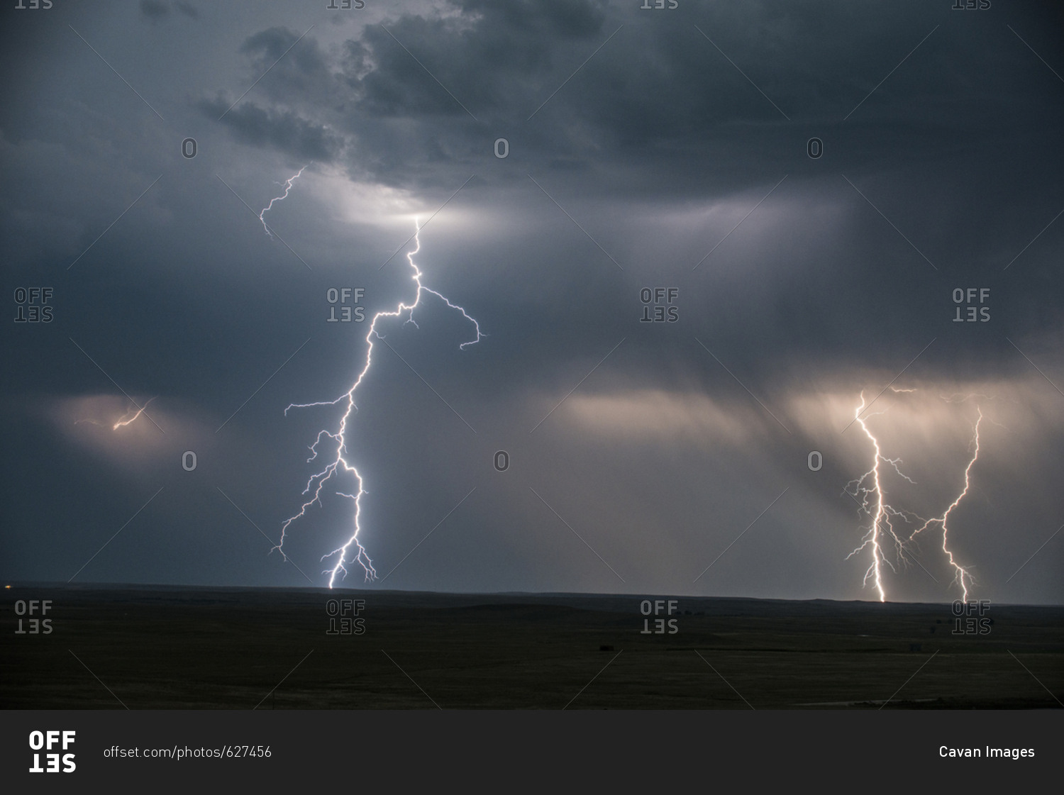 Low angle majestic view of thunderstorm and lightning at Badlands National Park