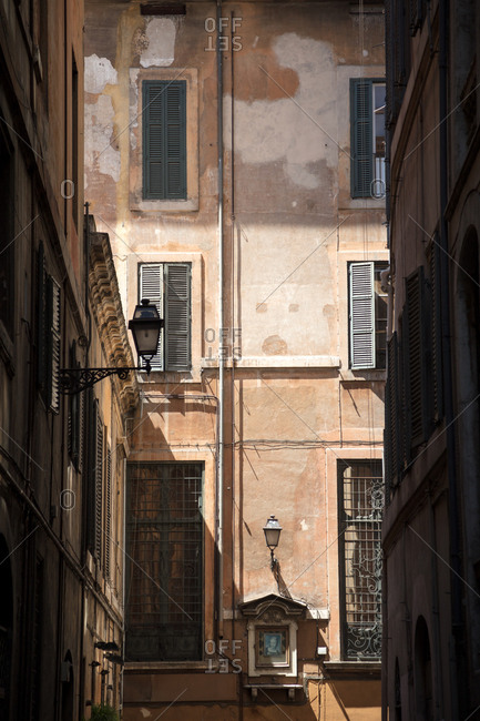 Rome, Italy - July 10, 2017: A portrait hangs in an alley