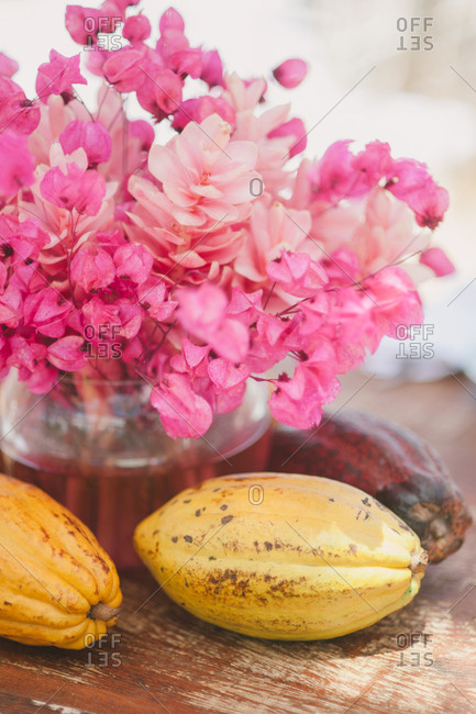 Centerpiece With Flowers And Tropical Fruit At Outdoor Wedding