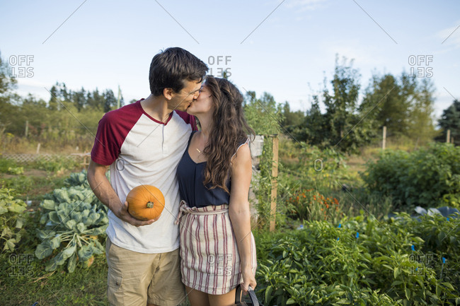 romantic young couple sitting in garden 20640476 Stock Photo at Vecteezy