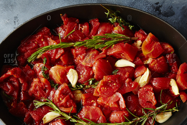 Slow roasted canned tomatoes in a frying pan