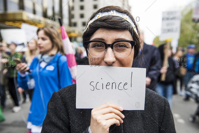 New York City, New York, USA - April 22, 2017: Woman holding "science" sign at the March for Science