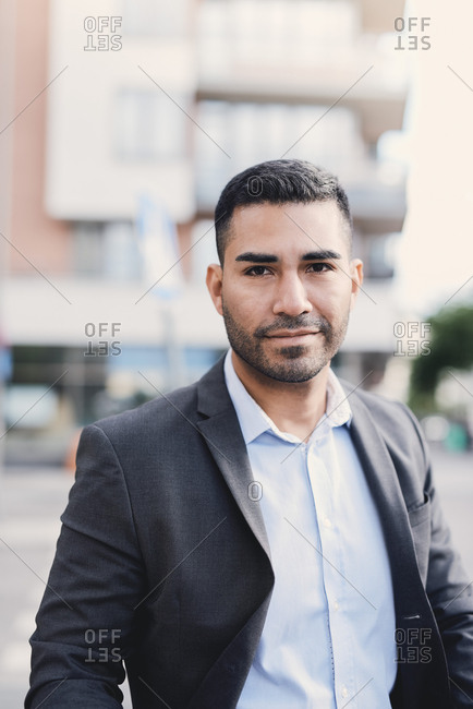 Portrait of confident businessman in city