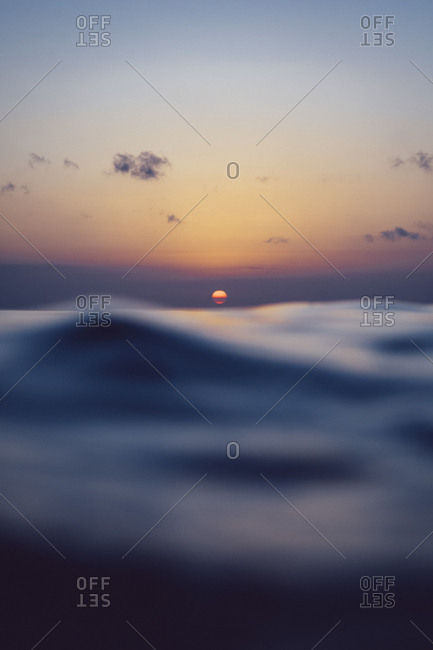 Ocean waves and sunset off the coast of Bali