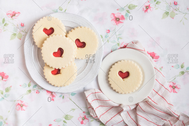 Plates of Valentine\'s Day cookies with heart shaped design