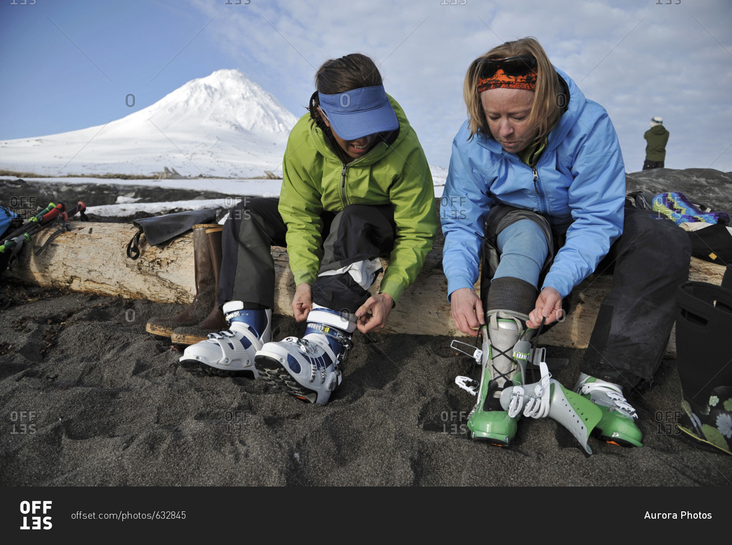 Two Female Skier Putting On Ski Boot In Cook Inlet, Alaska, Usa