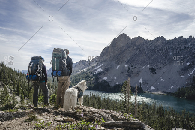 Couple backpacking with dog above Alice Lake Sawtooth Mountains, Idaho