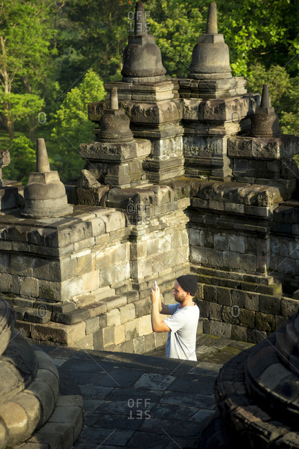 Tourist Exploring Borobudur Temple In Yogyakarta, Java, Indonesia
