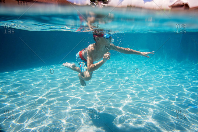 Underwater view of boy in a swimming pool