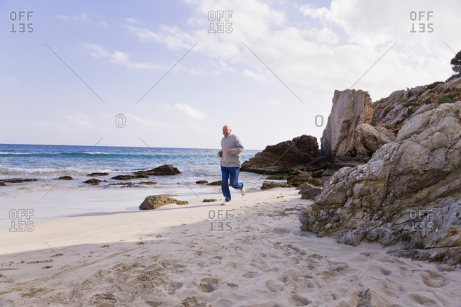 Man Jogging on the Beach