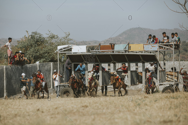 Indonesia, Sumbawa Besar - September 21, 2017: Jockeys competing in traditional horse racing