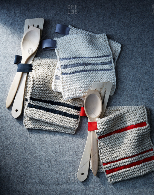 Knitted pot holders and wooden spoons
