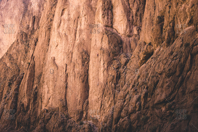 A rock climber at scaling walls of Tondra Gorge, Morocco