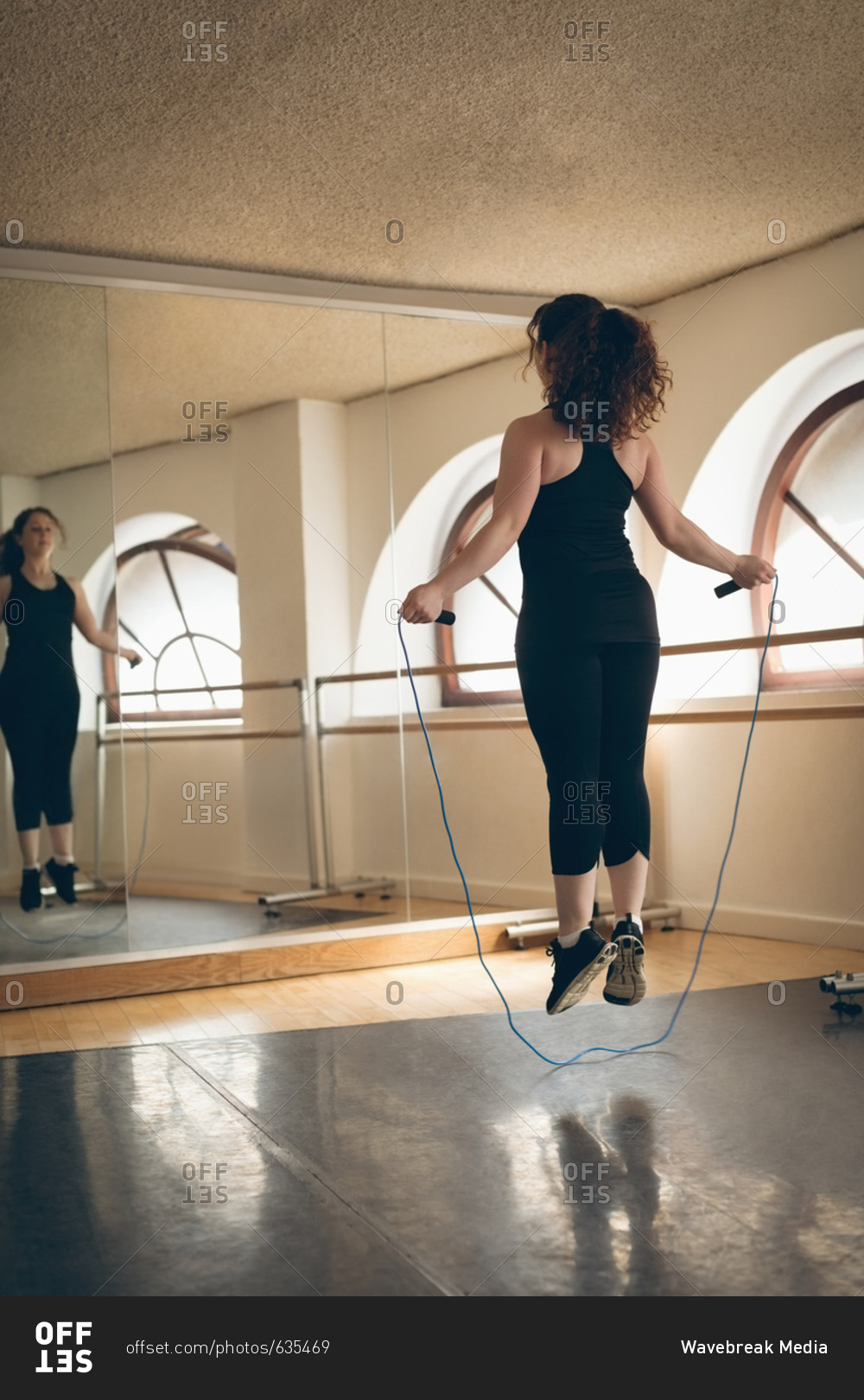 Irish dancer feet jumping with skipping rope in the studio
