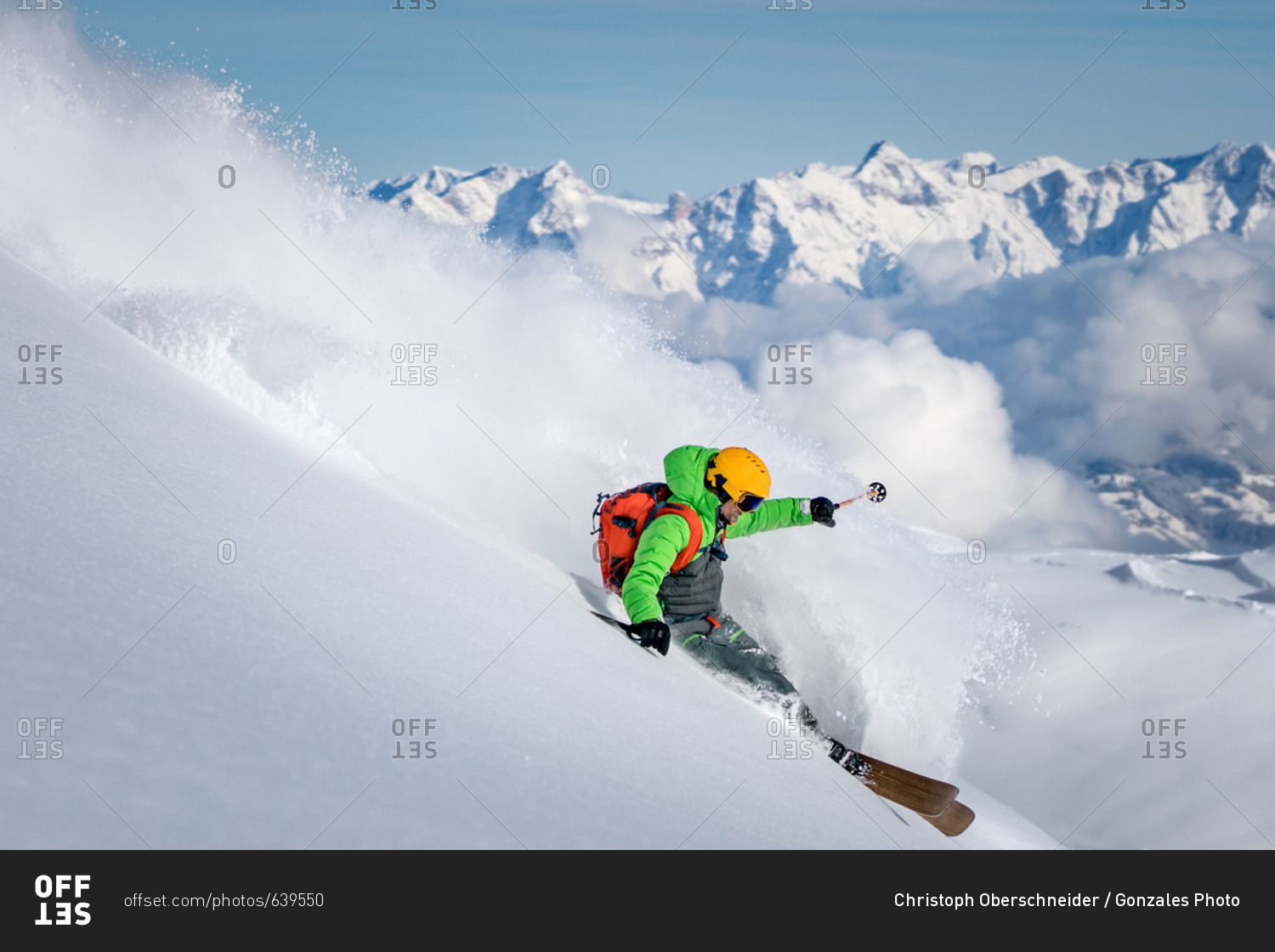 A male skier skiing in powder snow at the Kitzsteinhorn Glacier near Salzburg in Austria