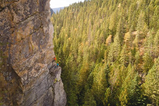 Mountaineer climbing the rocky cliff