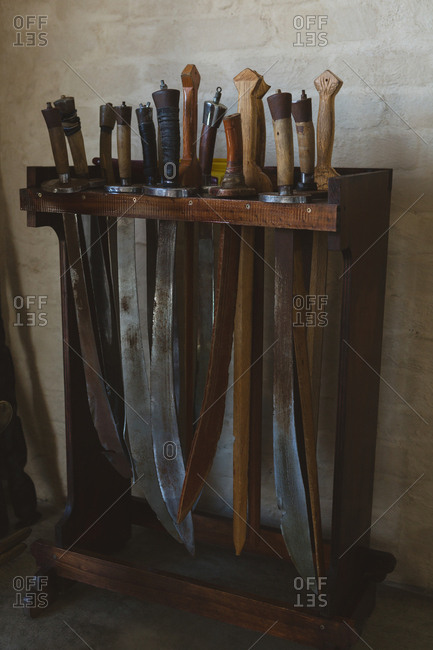 Sword arranged on wooden rack