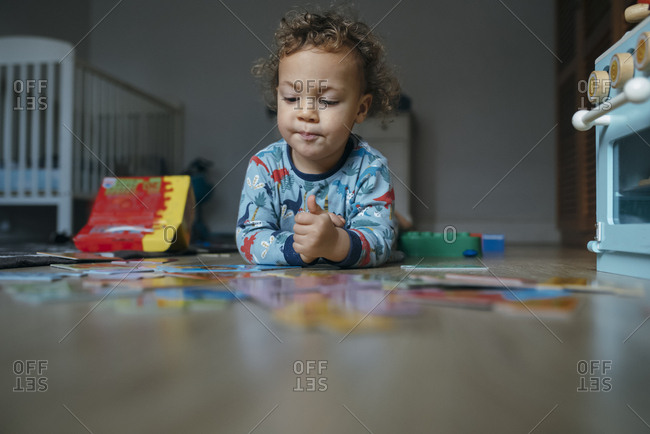 Boy plays with wooden food set