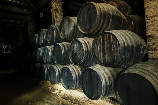 Stack of old casks in a cellar