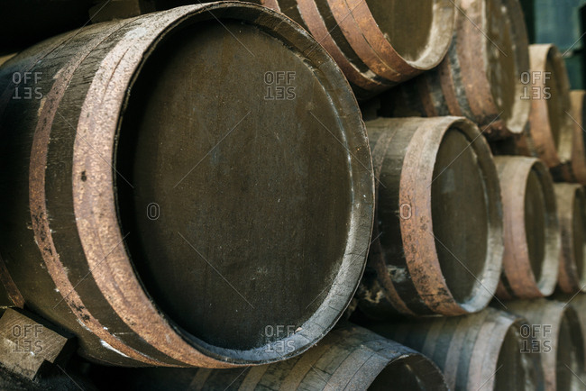 Stack of old casks in a cellar