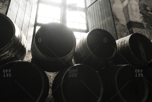 Stack of old casks in a cellar