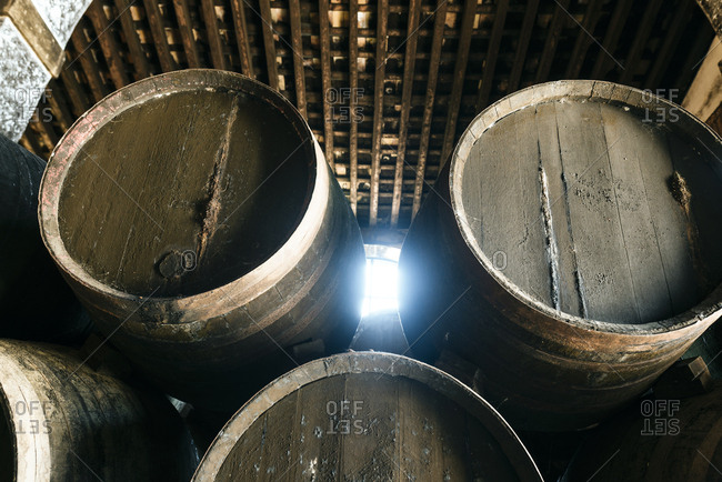 Stack of old casks in a cellar