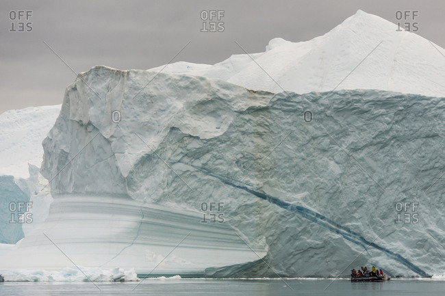 Greenland - September 6, 2017: Boat with people on an expedition through Scoresby Sound in Greenland