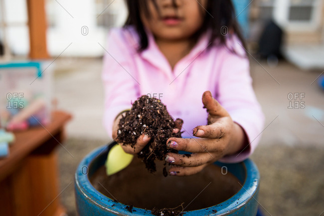 Girl digging through dirt