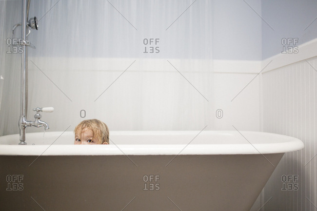 Portrait of playful girl in bathtub