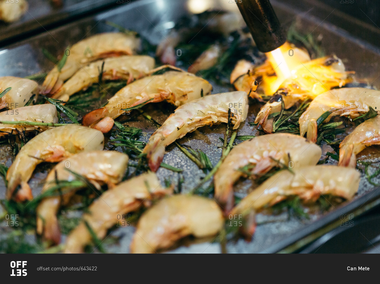 Blow torching shrimp entree Offset stock photo OFFSET