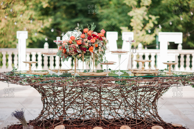 Floral Arrangements On Table With Empty Serving Trays At Outdoor