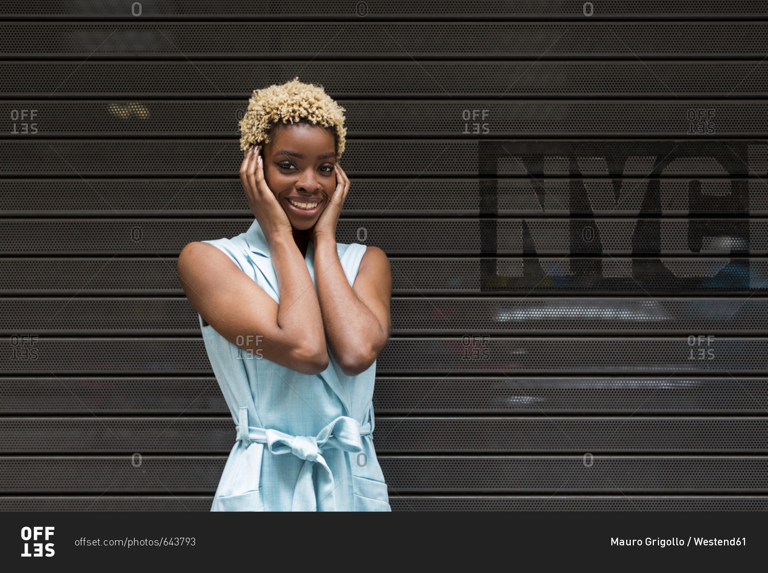 USA- New York- happy young blonde african-american woman- smiling- hand on head