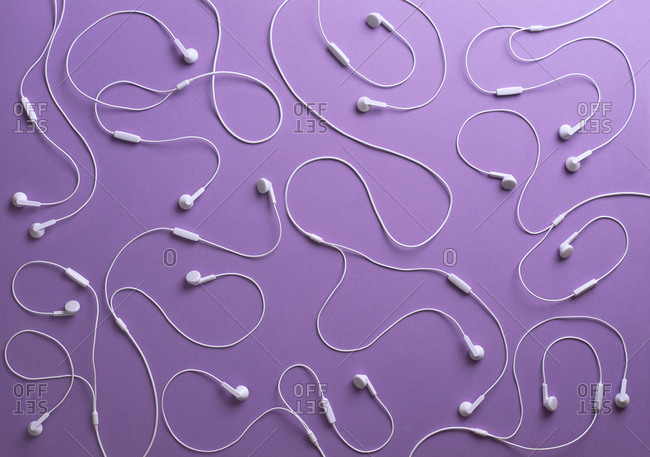White earphones on purple background- 3D Rendering