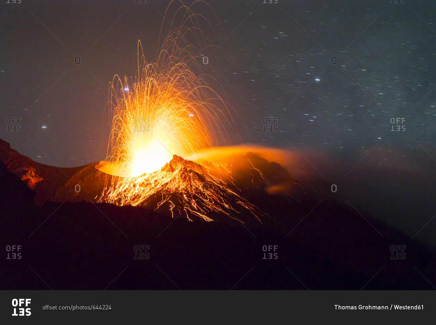 Italy- Aeolian Islands- Stromboli- volcanic eruption before night sky background- lava bombs