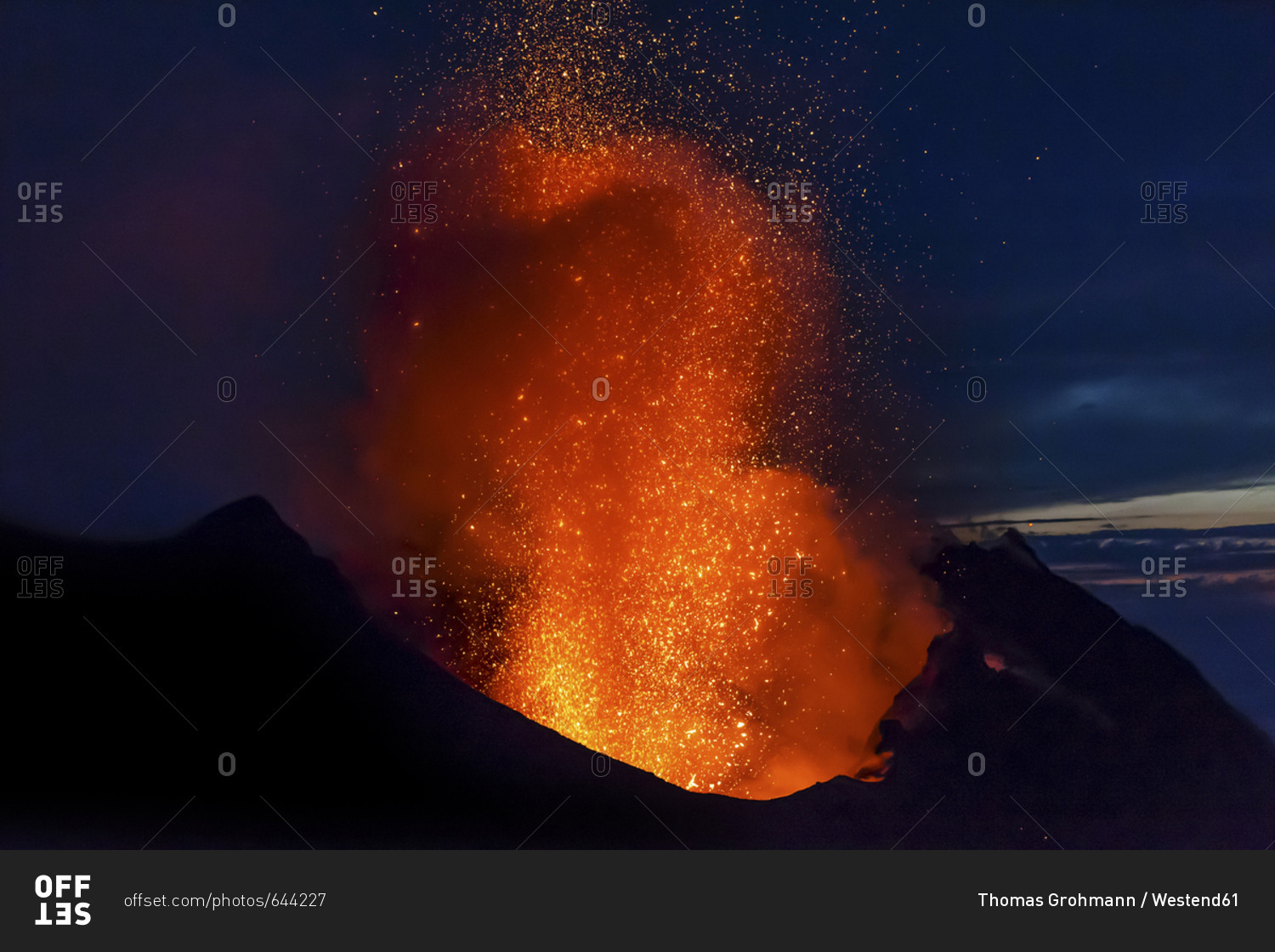 Italy- Aeolian Islands- Stromboli- volcanic eruption before night sky background- lava bombs