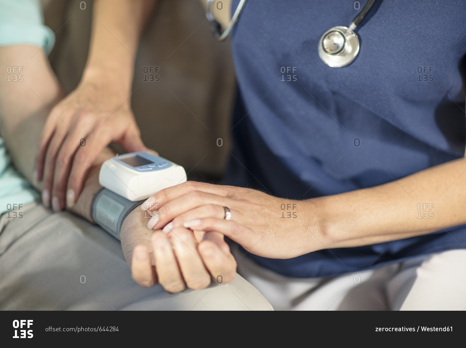 nurse-taking-blood-pressure-of-senior-patient-at-home-stock-photo-offset