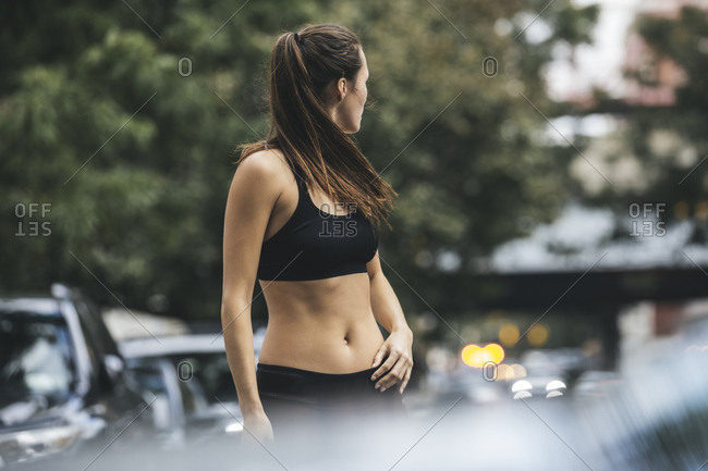 Fit Young Woman In Sportswear Standing On City Street