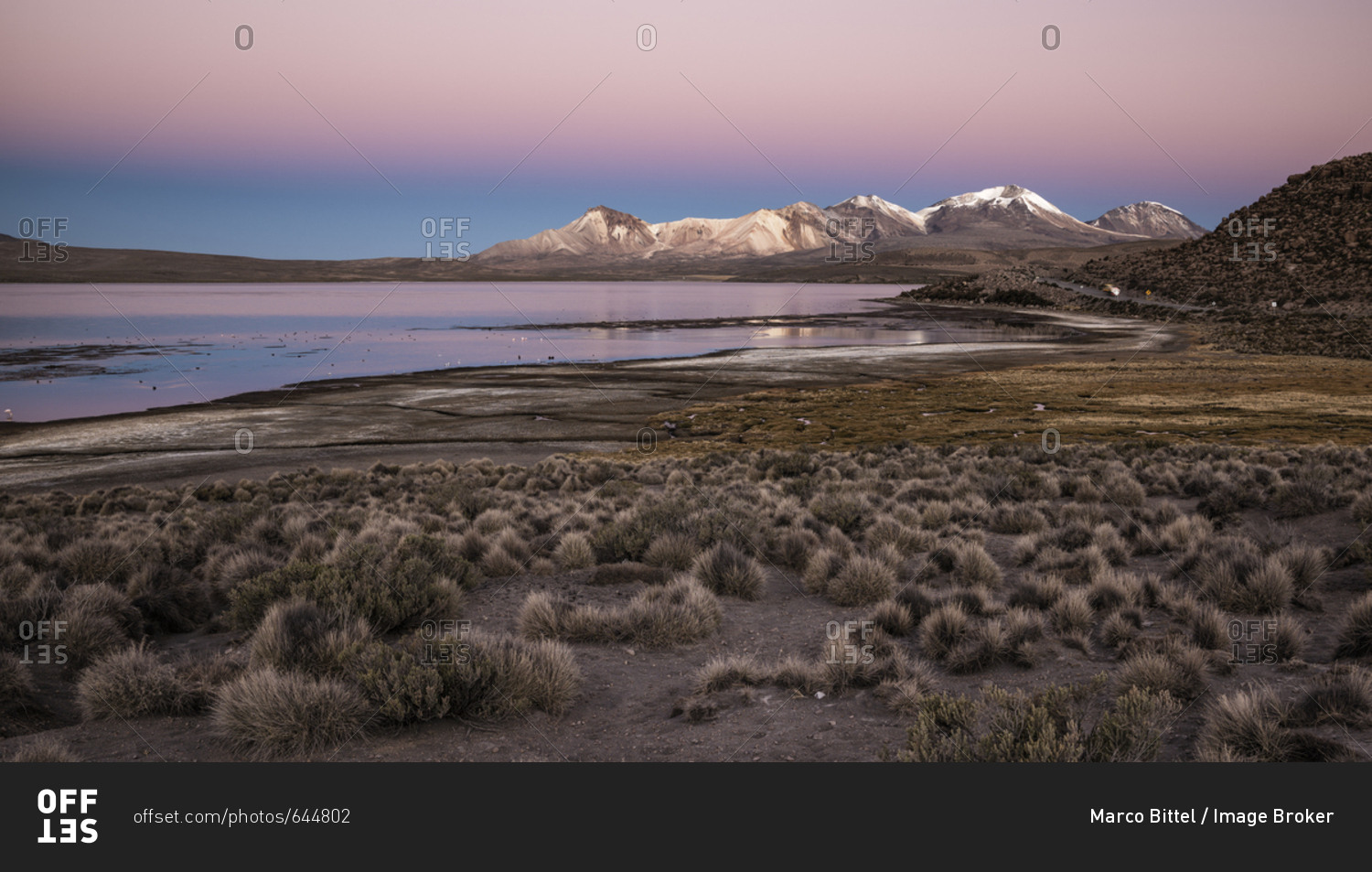 Lake Lago Chungara, red evening sky, Nevados de Quimsachata, Uqi Uqini ...