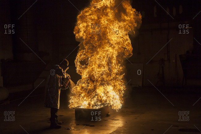 Firefighter extinguishes a heptane 2B-Pan fire with a 2-BTP extinguisher, Illinois, Chicago, USA, North America