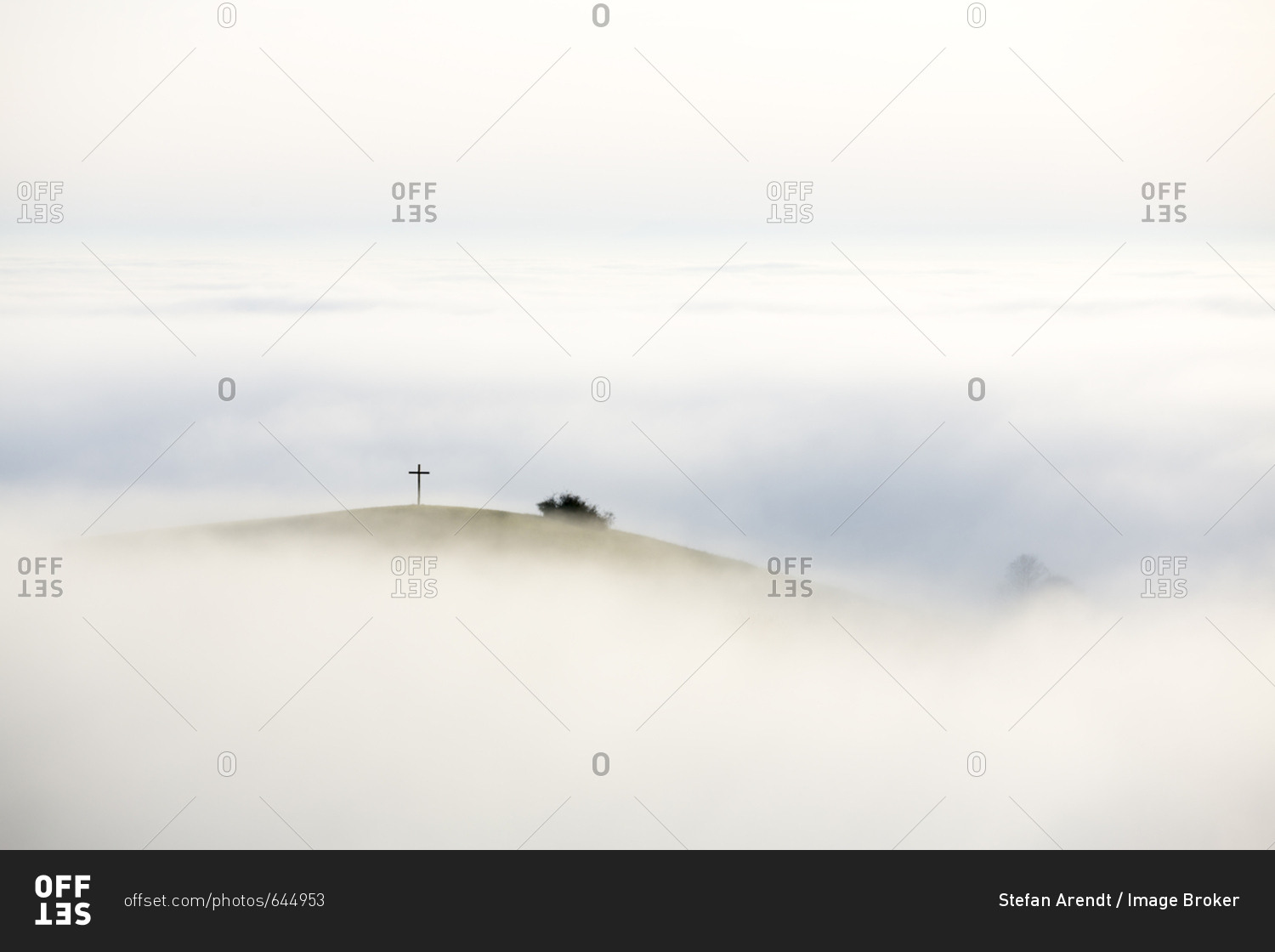 Foggy view of Bisberg with summit cross, Hegau, Baden-Wurttemberg, Germany, Europe